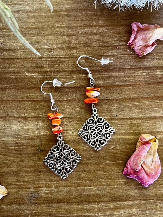 Orange spiny dangle earrings