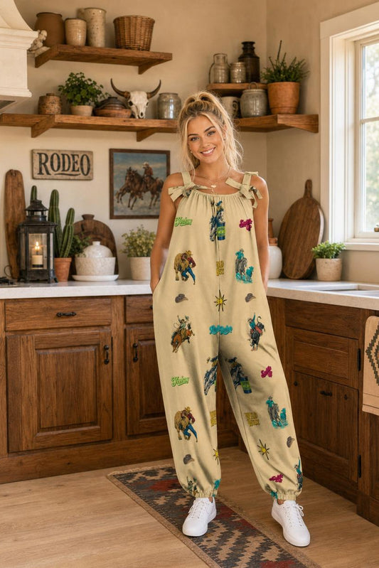 Woman in a kitchen wearing a colorful patterned jumpsuit.
