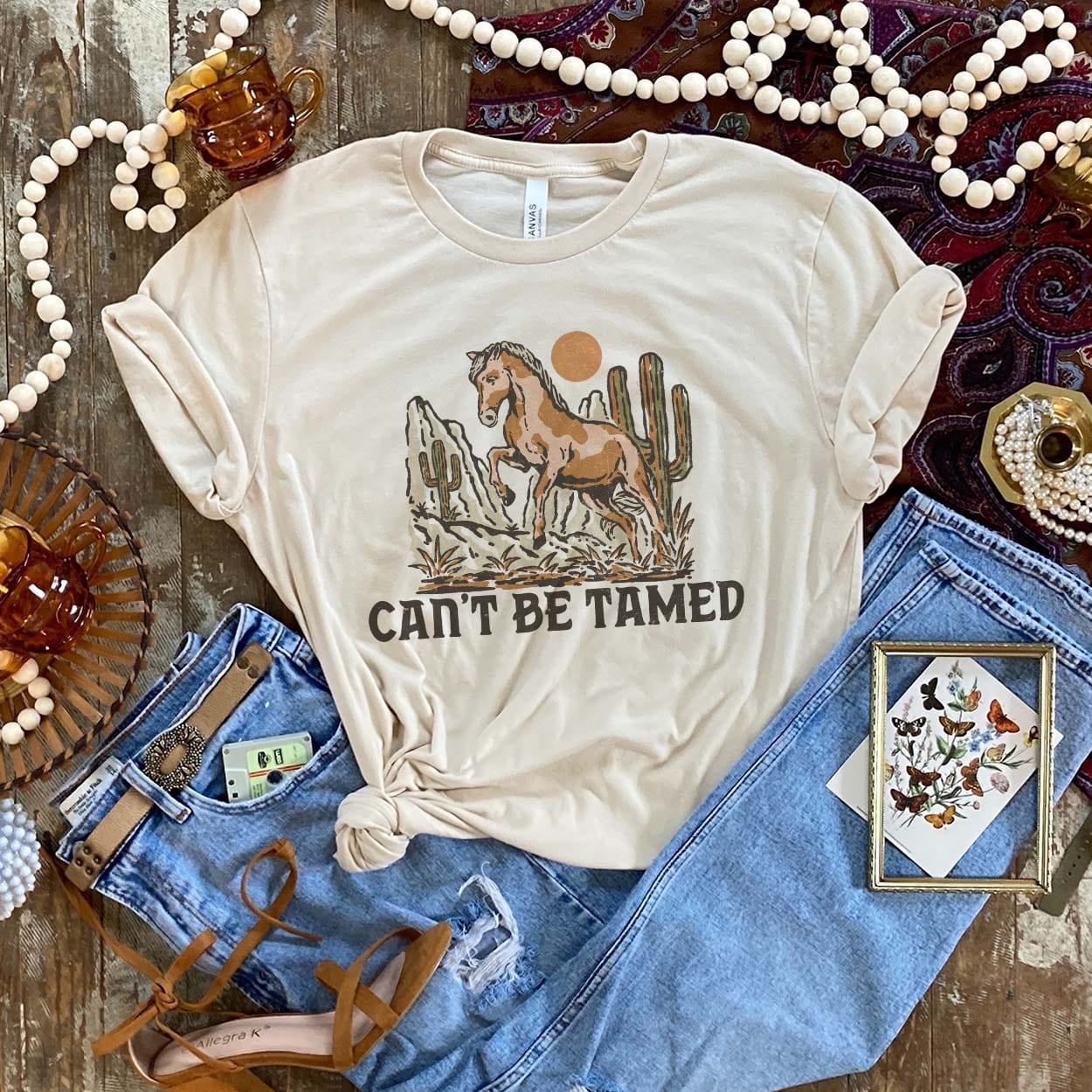 Can't Be Tamed Tee - cow, cowgirls, cows, desert, graphic, horse, shirt, tee, tees, western -  - Baha Ranch Western Wear