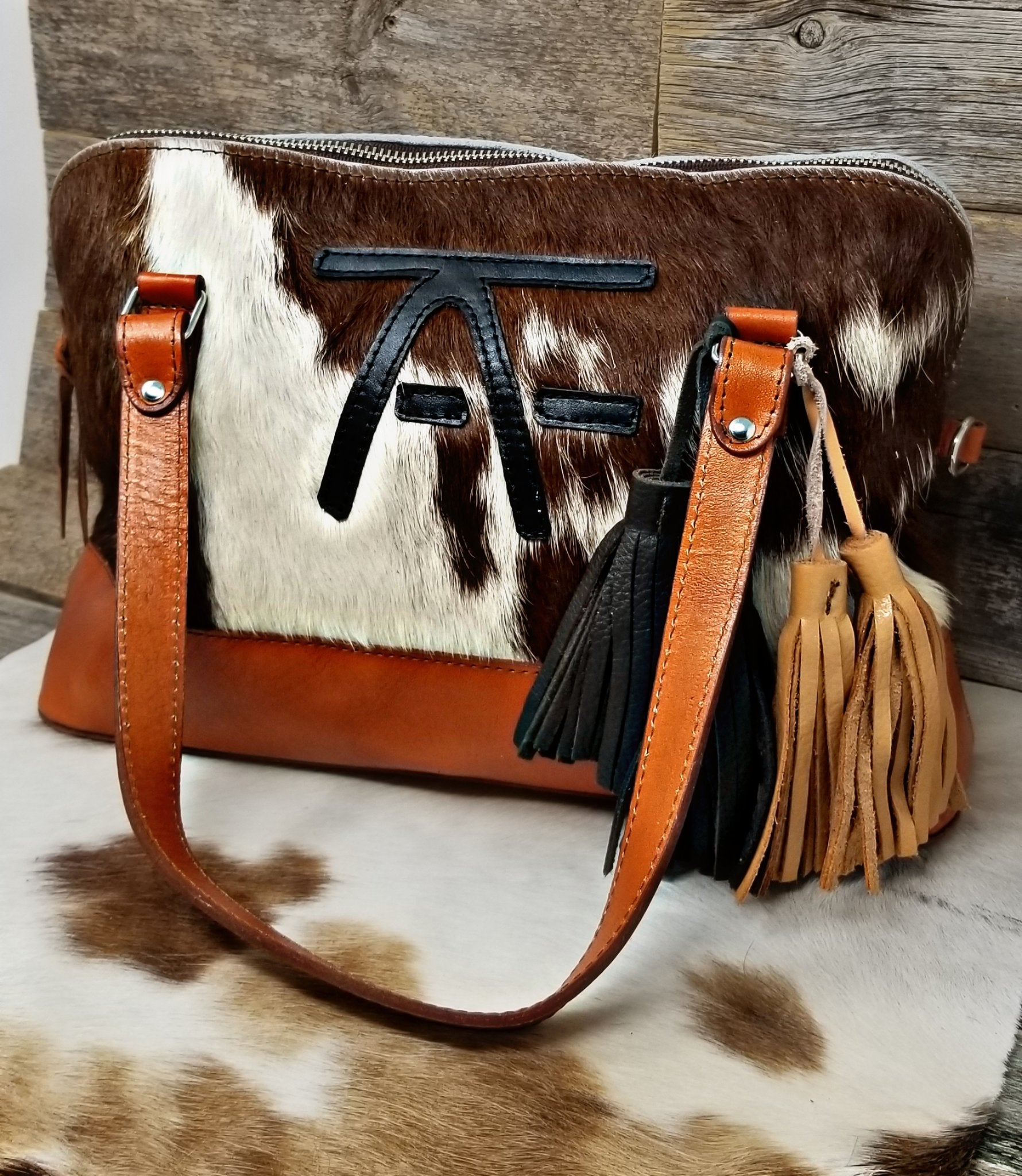 Cowhide hot sale messenger bag