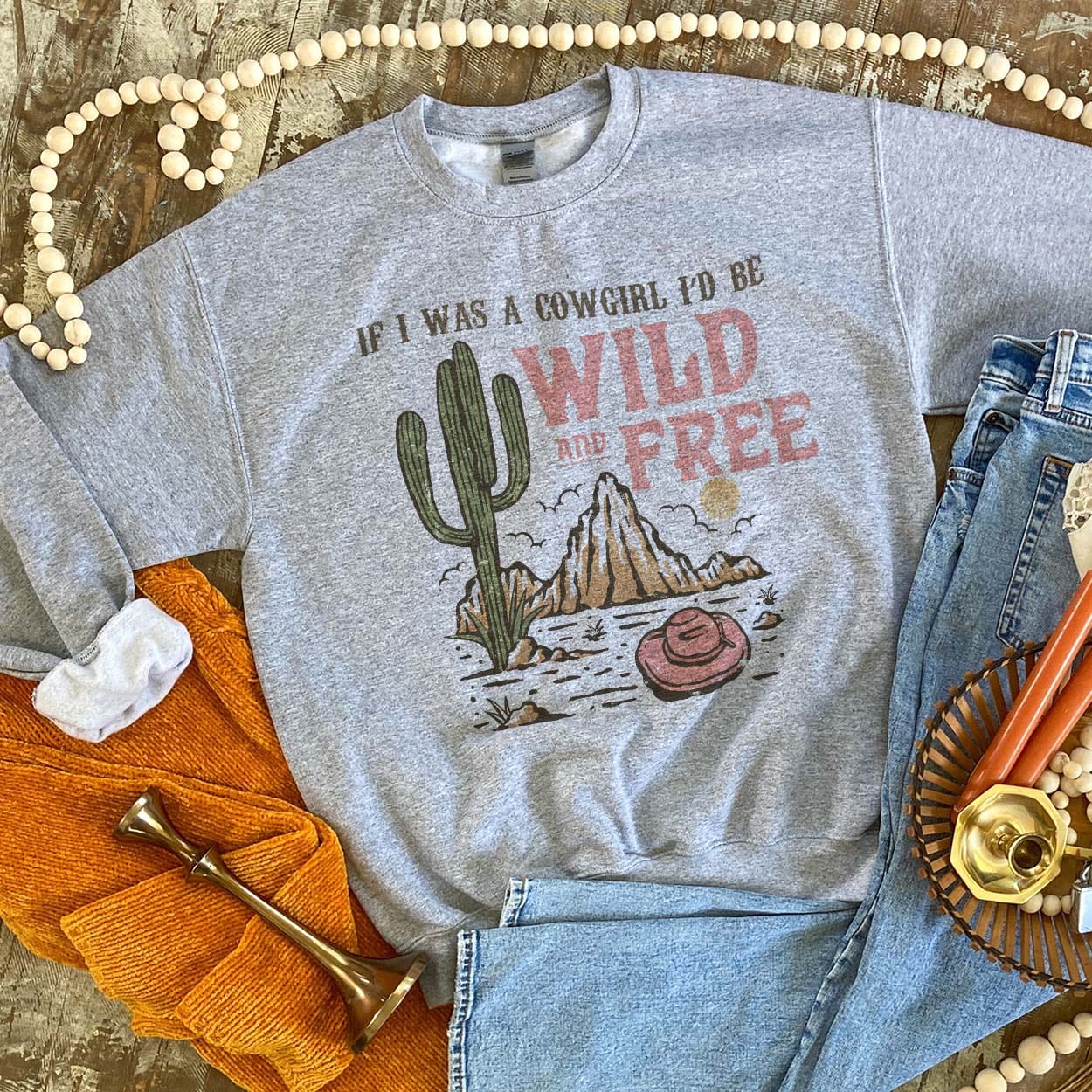 Wild and Free Sweatshirt - boot, boots, cactus, cowboy hat, cowgirl, cowgirl hat, desert, free, horseshoe, horseshoes, southwestern, sweat shirt, sweater, sweatshir, sweatshirt, western, white, white sweatshirt, wild -  - Baha Ranch Western Wear